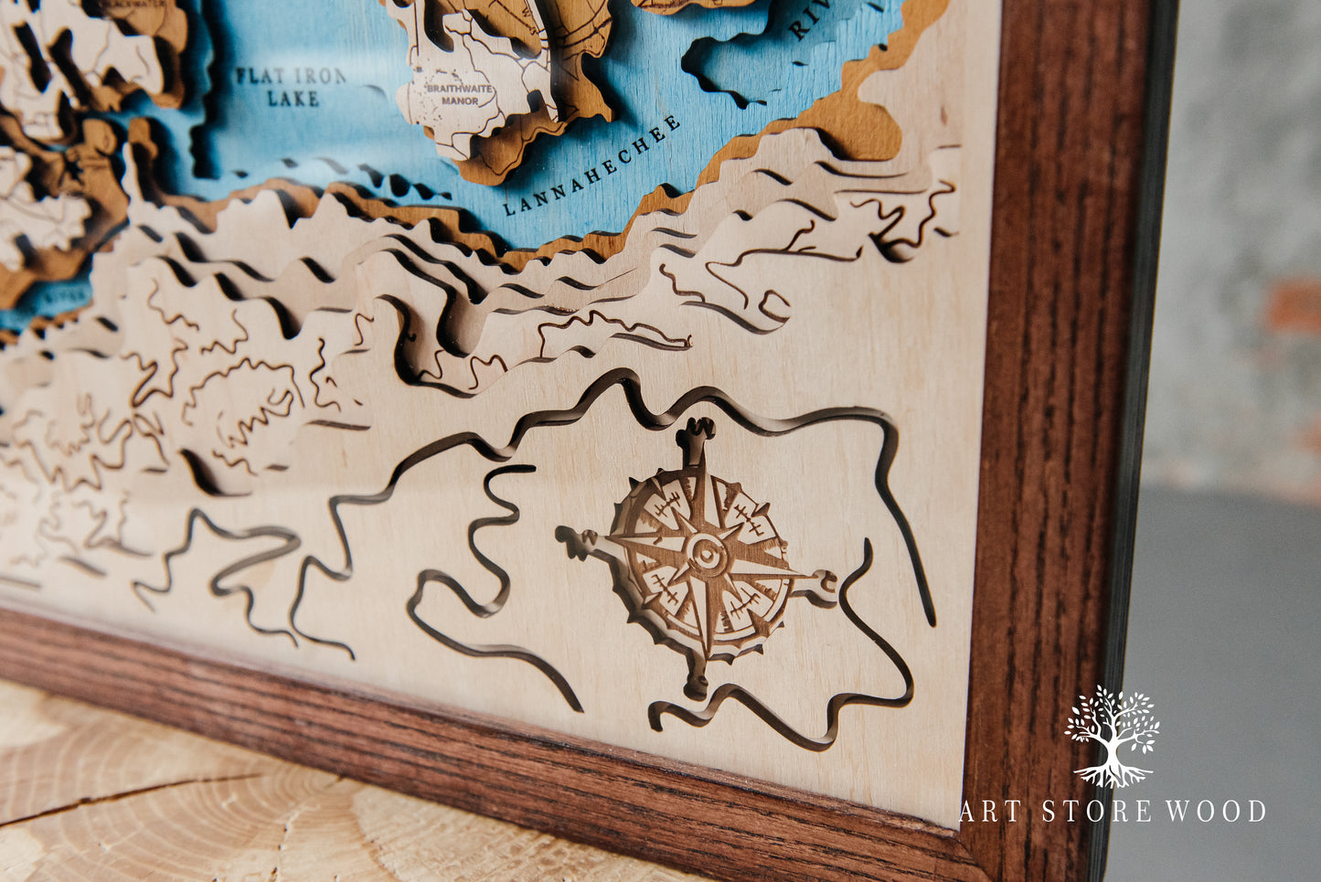 Engraved rivers and mountains on RDR2 wooden world map, detail view