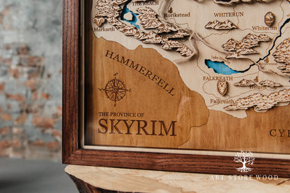 Close-up laser-cut detail of Skyrim wooden map showing terrain and cities