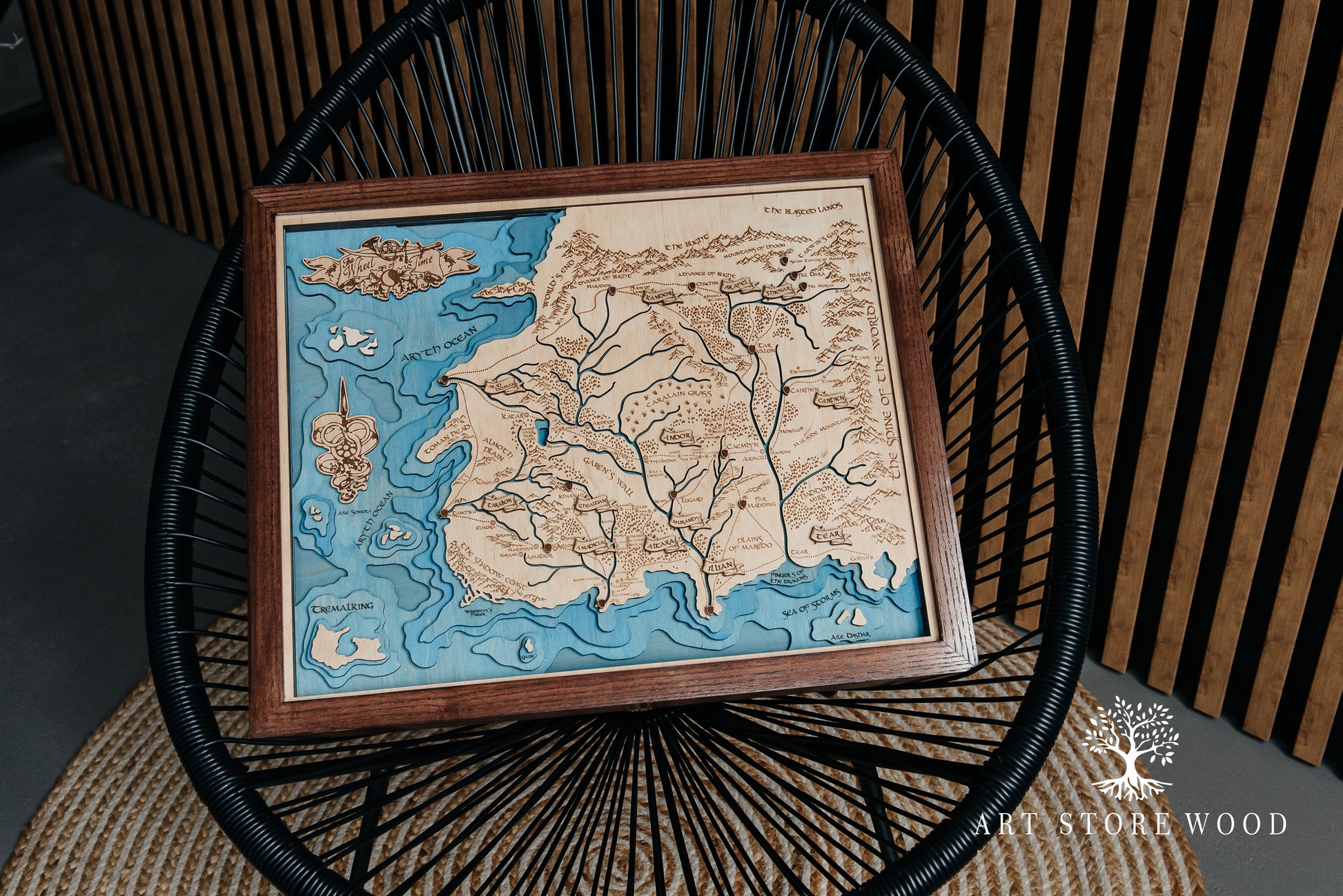 Interior shot – The Wheel of Time 3D wooden map mounted in a game room décor